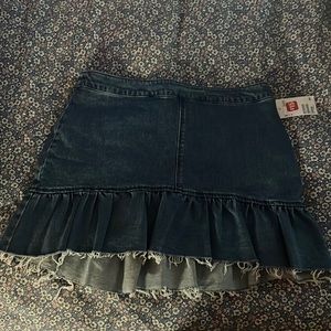 New with tags H&M raw flutter hem asymmetric denim skirt. Size 12.